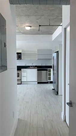 a view of kitchen with furniture and wooden floor