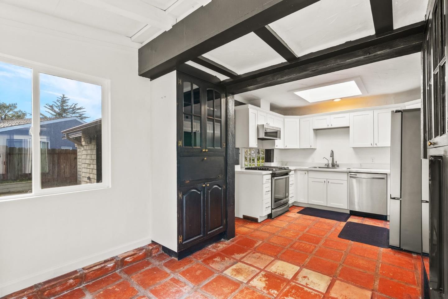 3041 Bird Rock Road Pebble Beach, CA 93953 - Photo 17 of 35 a large white kitchen with stainless steel appliances granite countertop a refrigerator and cabinets