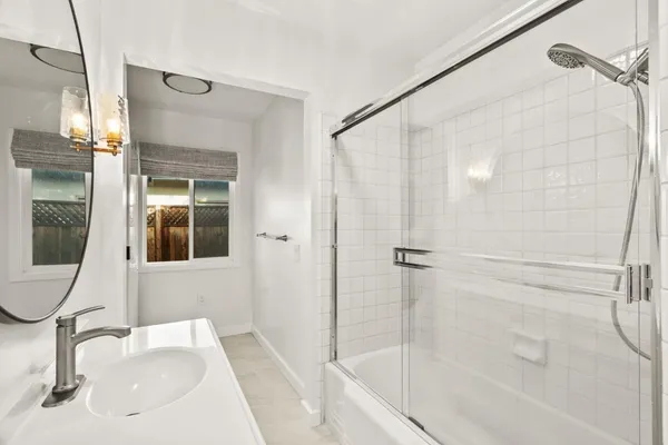 a bathroom with a toilet and a shower curtain