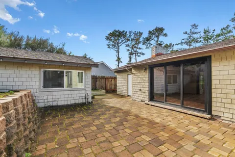 a view of a backyard with pathway