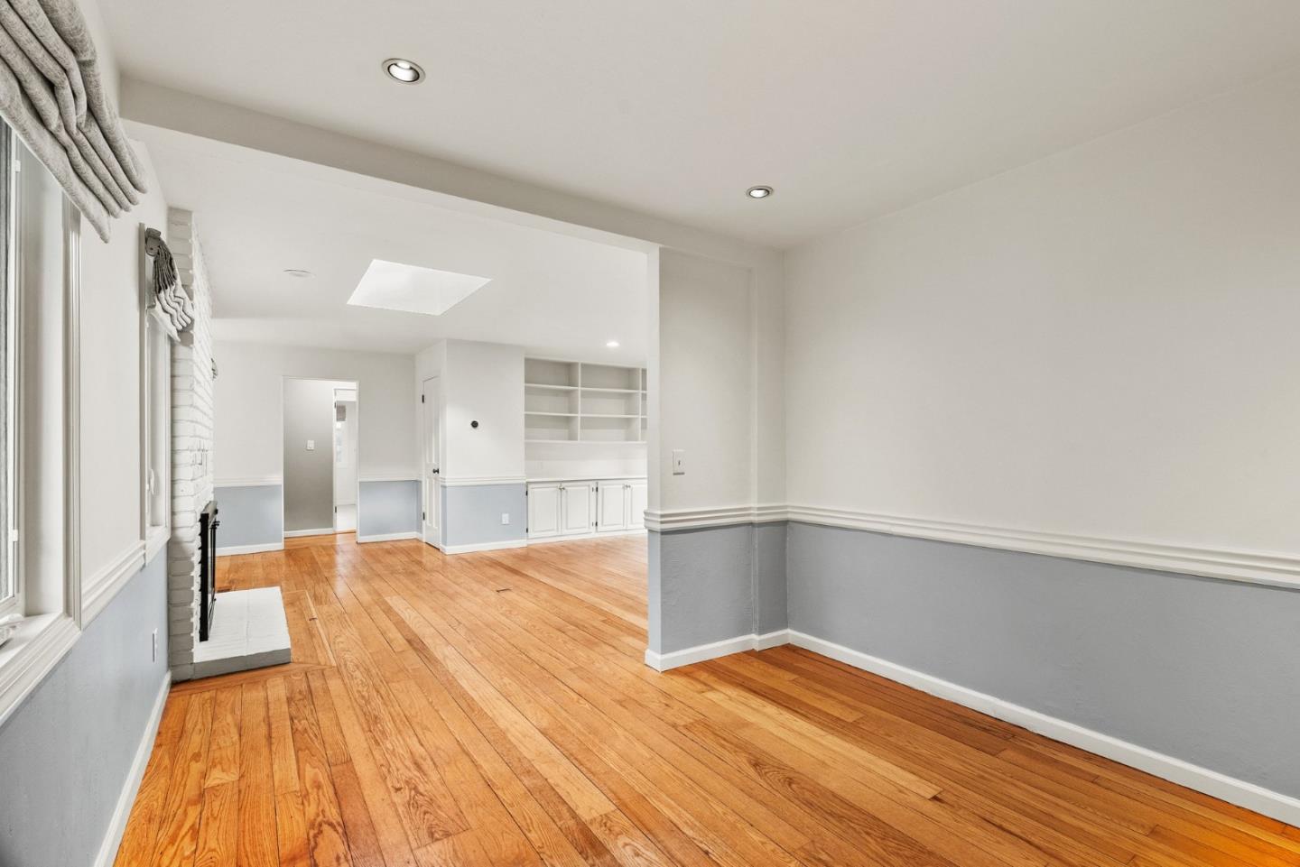 3041 Bird Rock Road Pebble Beach, CA 93953 - Photo 9 of 35 a view of an empty room with wooden floor and a window