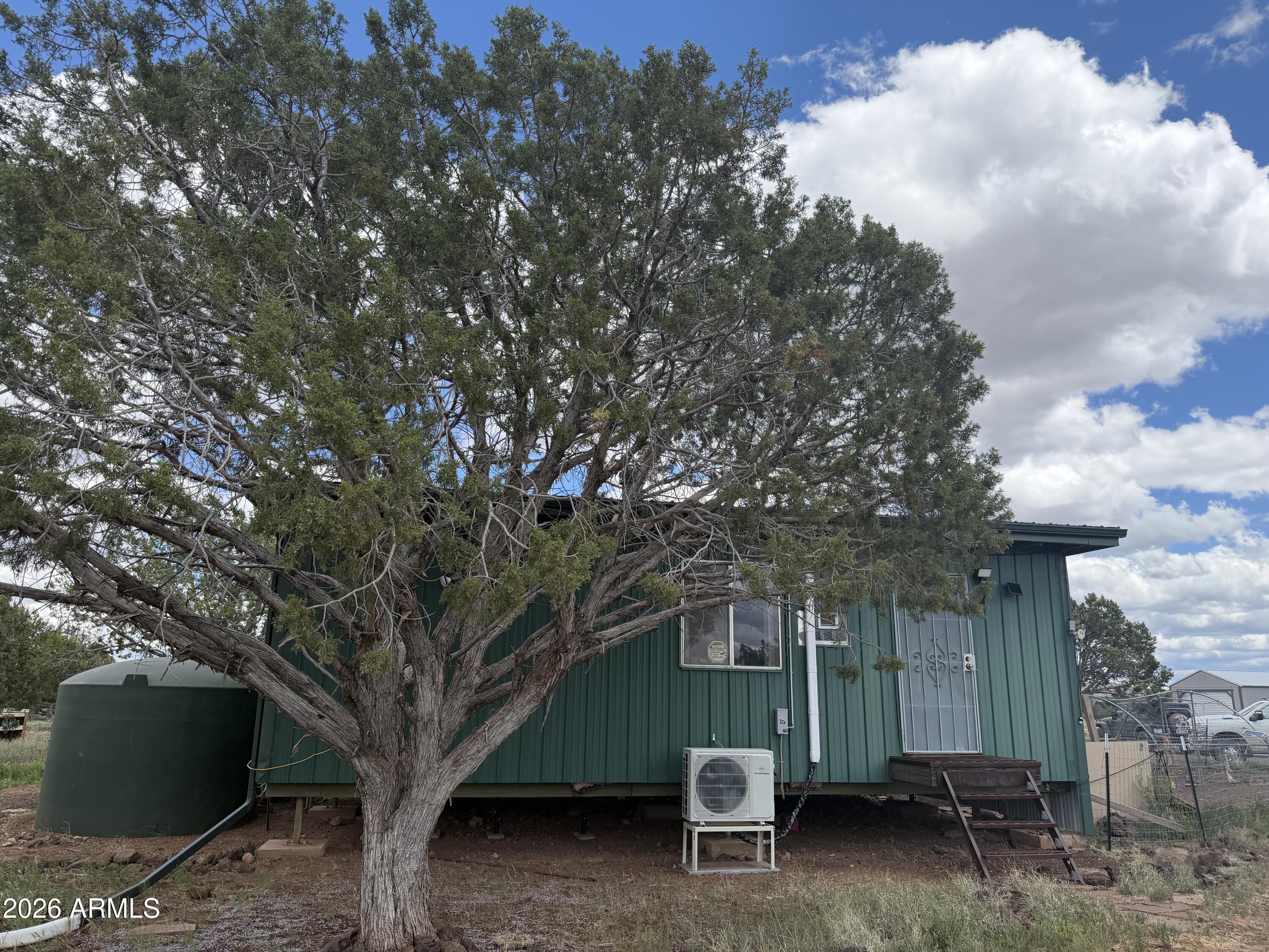 1 Hideaway Road Ash Fork, AZ 86320 - Photo 32 of 45 a view of a house with a tree and a tree