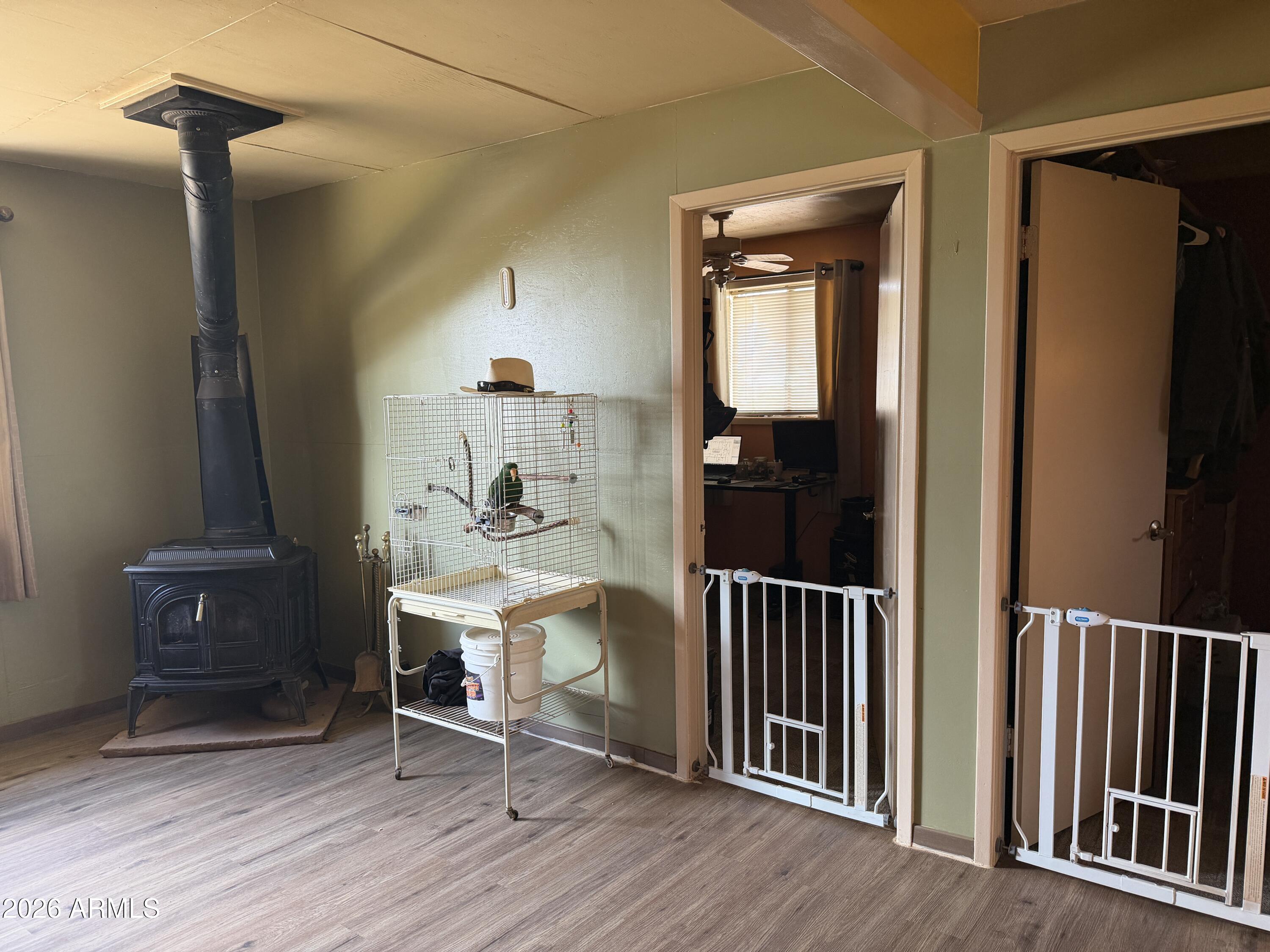 1 Hideaway Road Ash Fork, AZ 86320 - Photo 33 of 45 a view of a hallway with wooden floor and windows