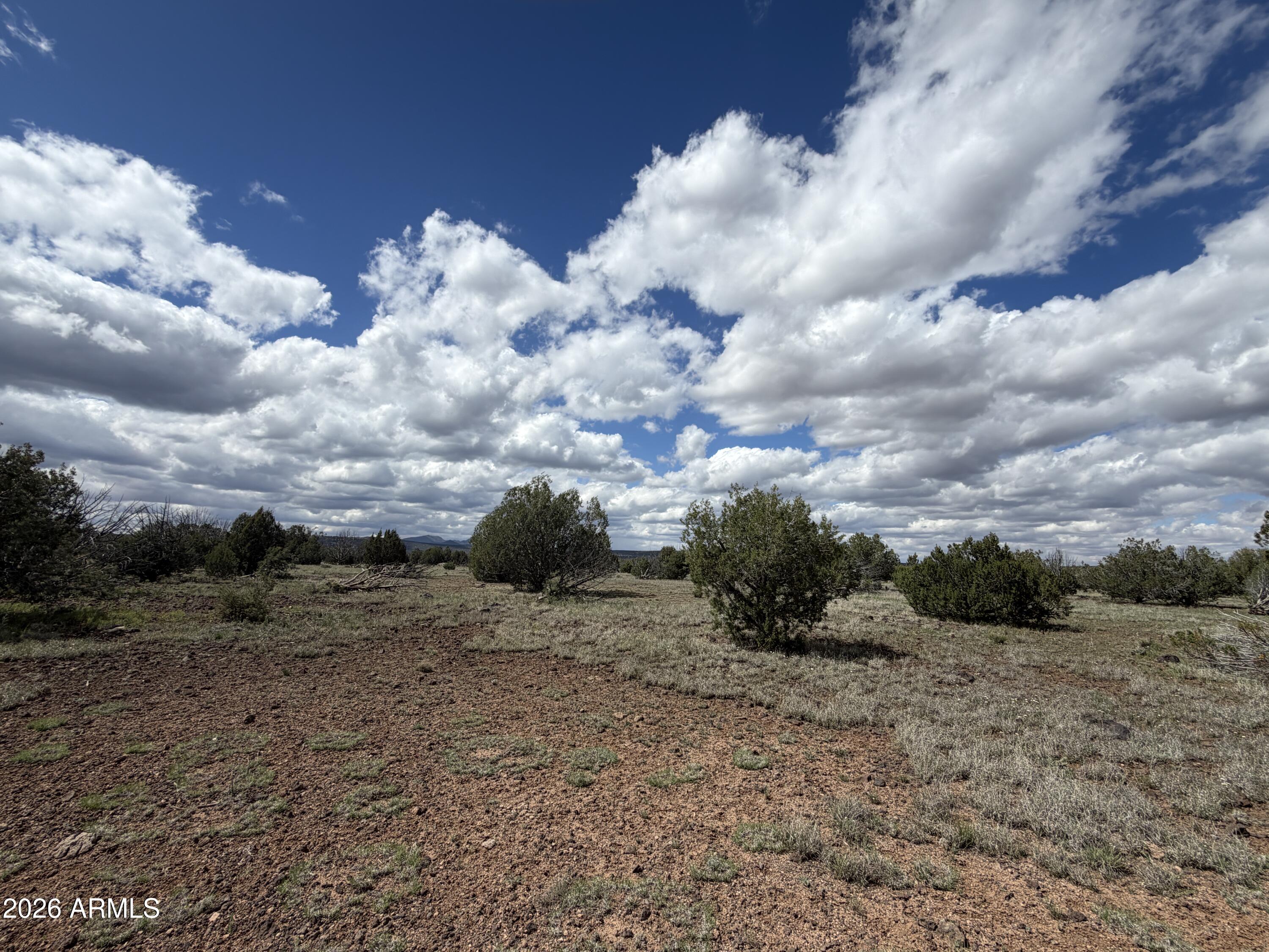 1 Hideaway Road Ash Fork, AZ 86320 - Photo 39 of 45 a view of a dry yard with wooden fence