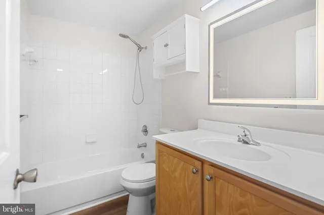 a view of an empty room with a fireplace