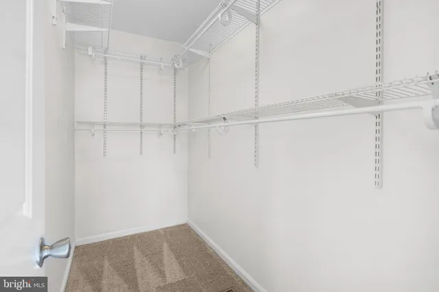 a bedroom with a bed and furniture