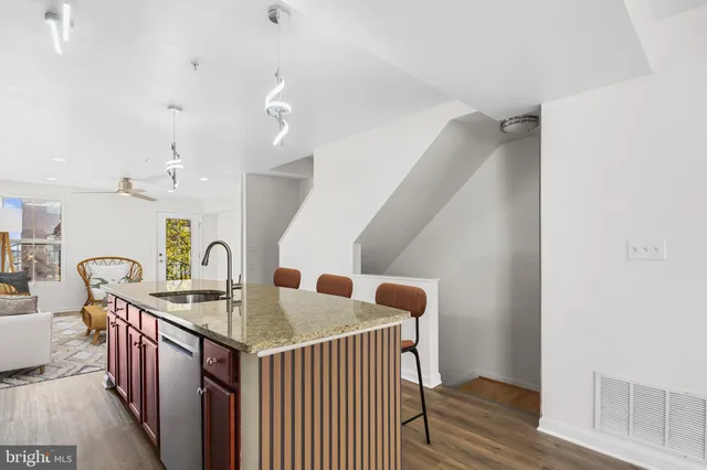 a dining room with furniture and wooden floor