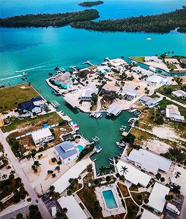 Undisclosed Address Englewood, FL 34223 - Photo 1 of 24 an aerial view of a house with a lake view