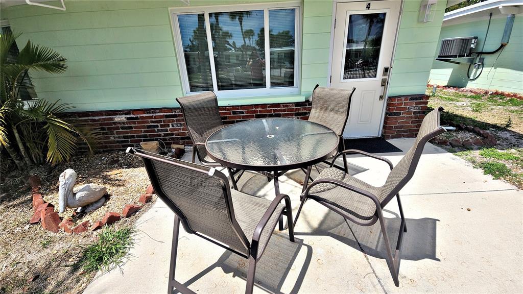 Undisclosed Address Englewood, FL 34223 - Photo 14 of 24 a view of a chairs and table in the patio