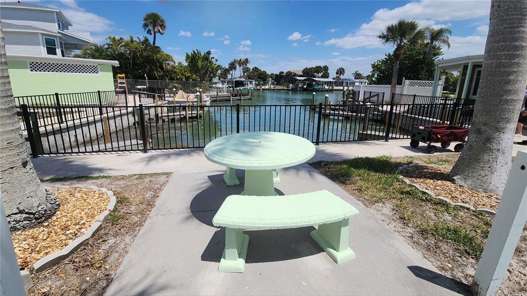 Undisclosed Address Englewood, FL 34223 - Photo 15 of 24 a view of a chairs and tables in the patio