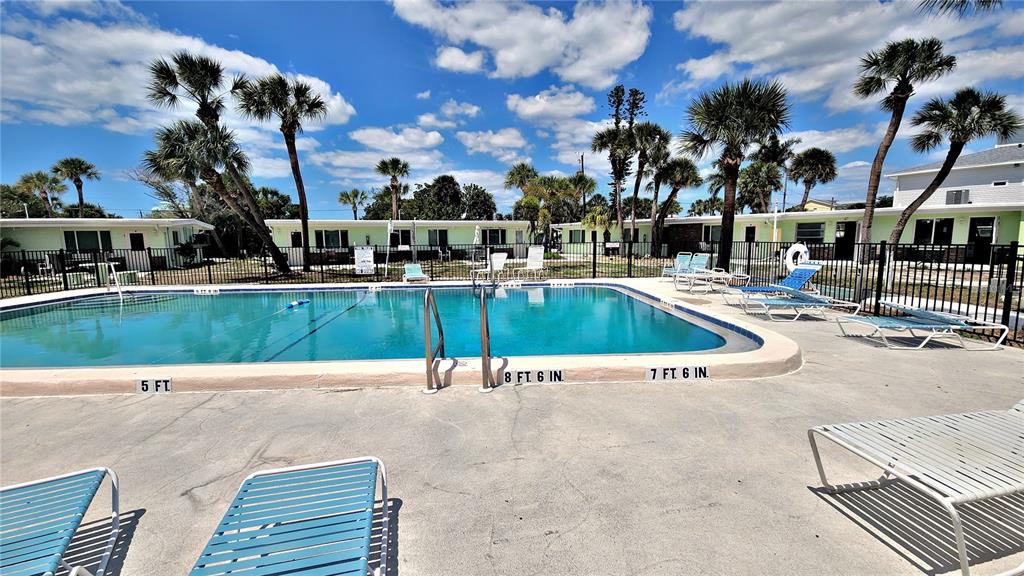 Undisclosed Address Englewood, FL 34223 - Photo 17 of 24 a view of a swimming pool with outdoor seating and plants