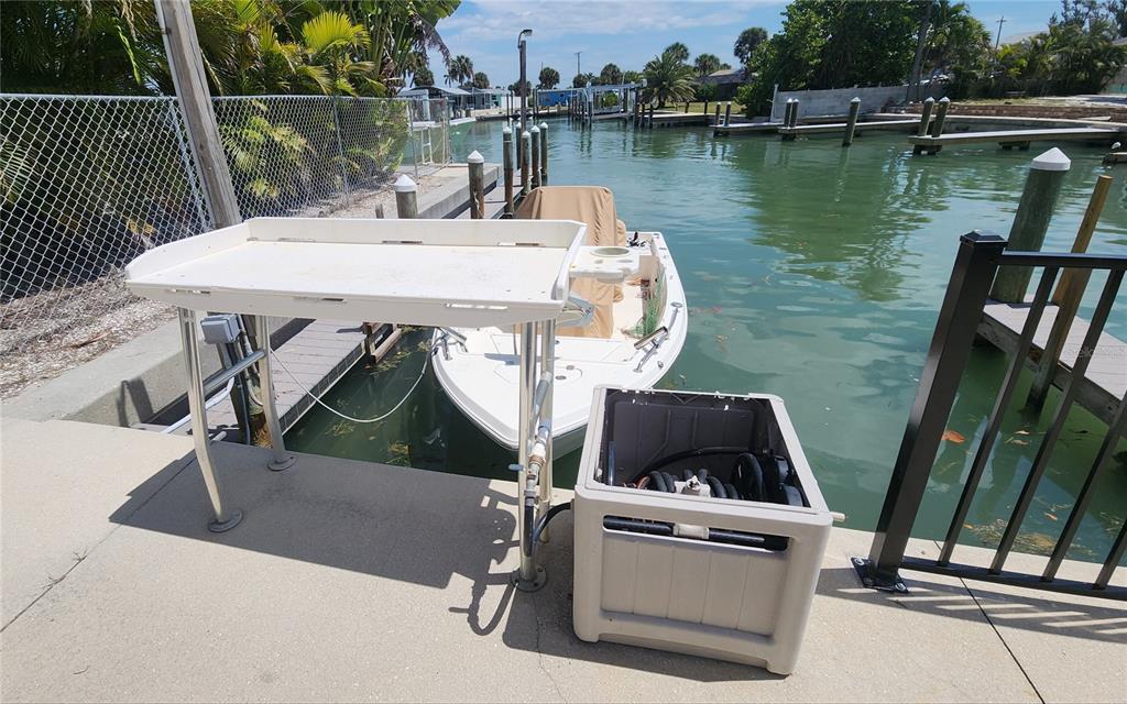 Undisclosed Address Englewood, FL 34223 - Photo 20 of 24 a view of a lake with couches chairs and wooden floor