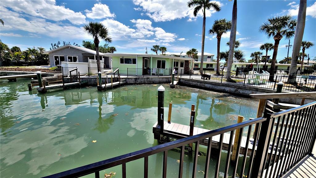Undisclosed Address Englewood, FL 34223 - Photo 21 of 24 a view of a lake from a balcony