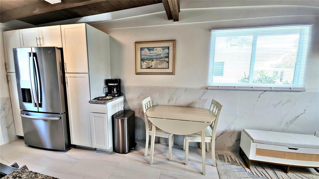 Undisclosed Address Englewood, FL 34223 - Photo 10 of 24 a kitchen with stainless steel appliances granite countertop a refrigerator a stove a sink and a refrigerator