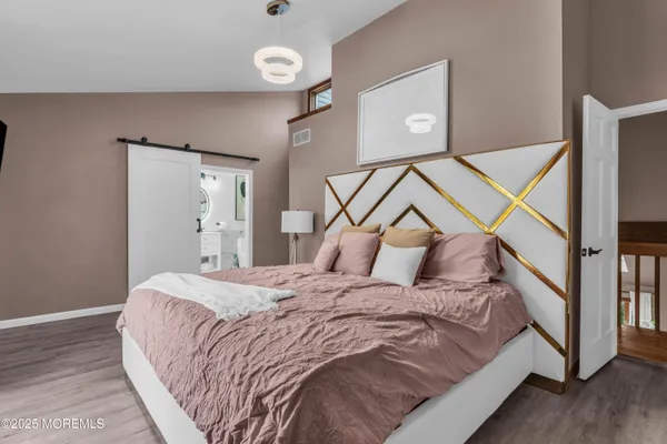 a bedroom with a bed and a walk in closet