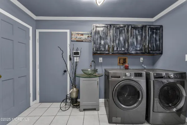 a view of storage and utility room with washer and dryer