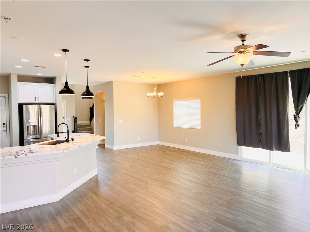 161 Dunblane Street Henderson, NV 89012 - Photo 6 of 56 An open-concept living area boasts a modern kitchen with a large island and ample space for gatherings.