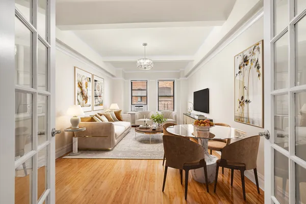 a living room with furniture wooden floor and a flat screen tv