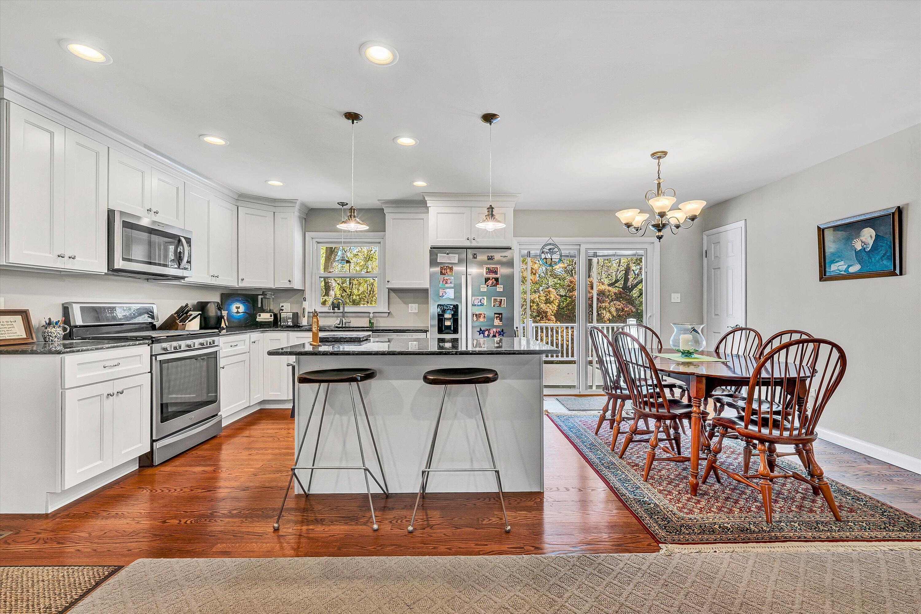 2312 Kipling Street Southwest Roanoke, VA 24018 - Photo 11 of 52 a kitchen with stainless steel appliances granite countertop a table and chairs in it