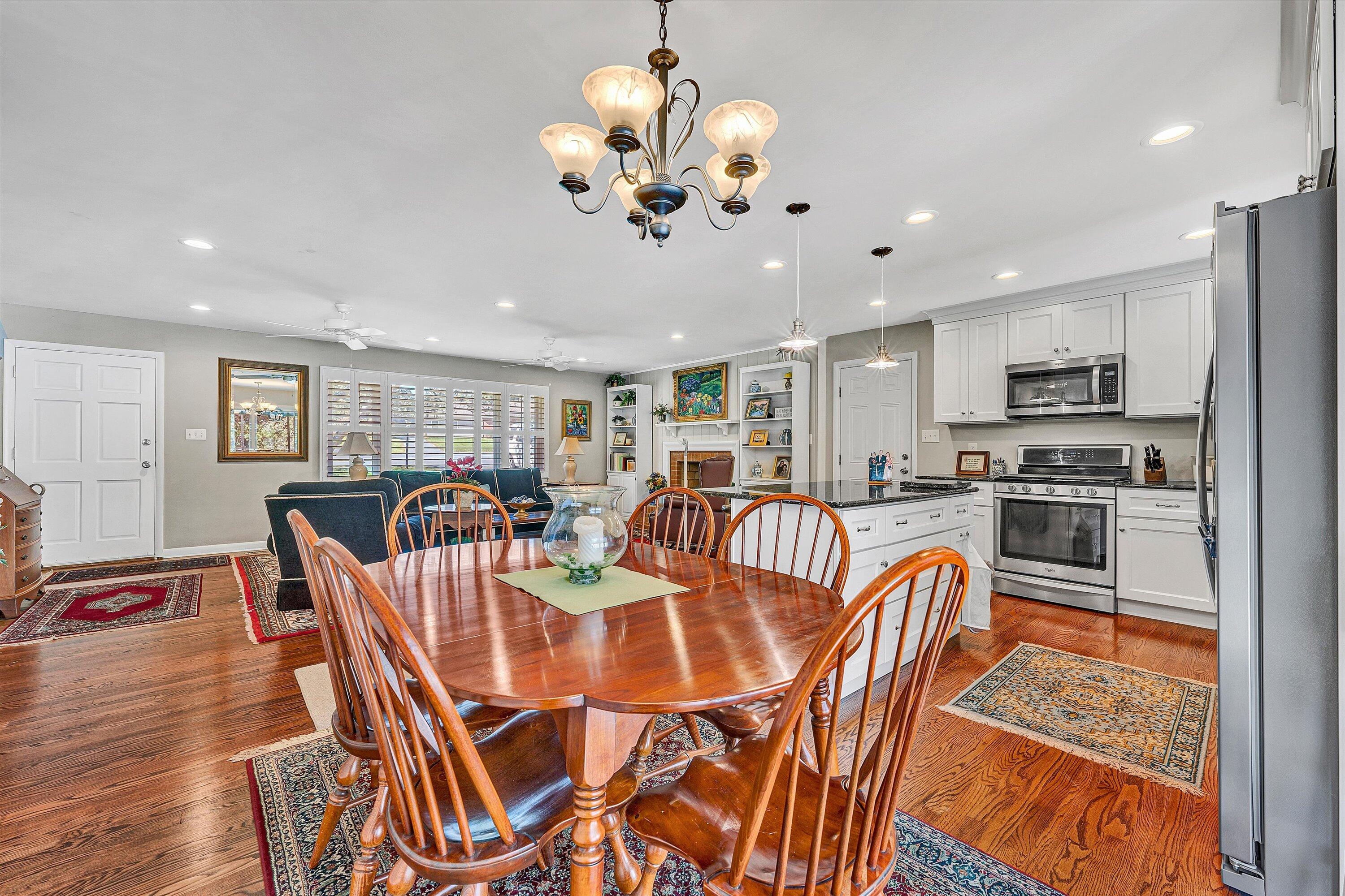 2312 Kipling Street Southwest Roanoke, VA 24018 - Photo 13 of 52 a view of a dining room with furniture a kitchen and chandelier