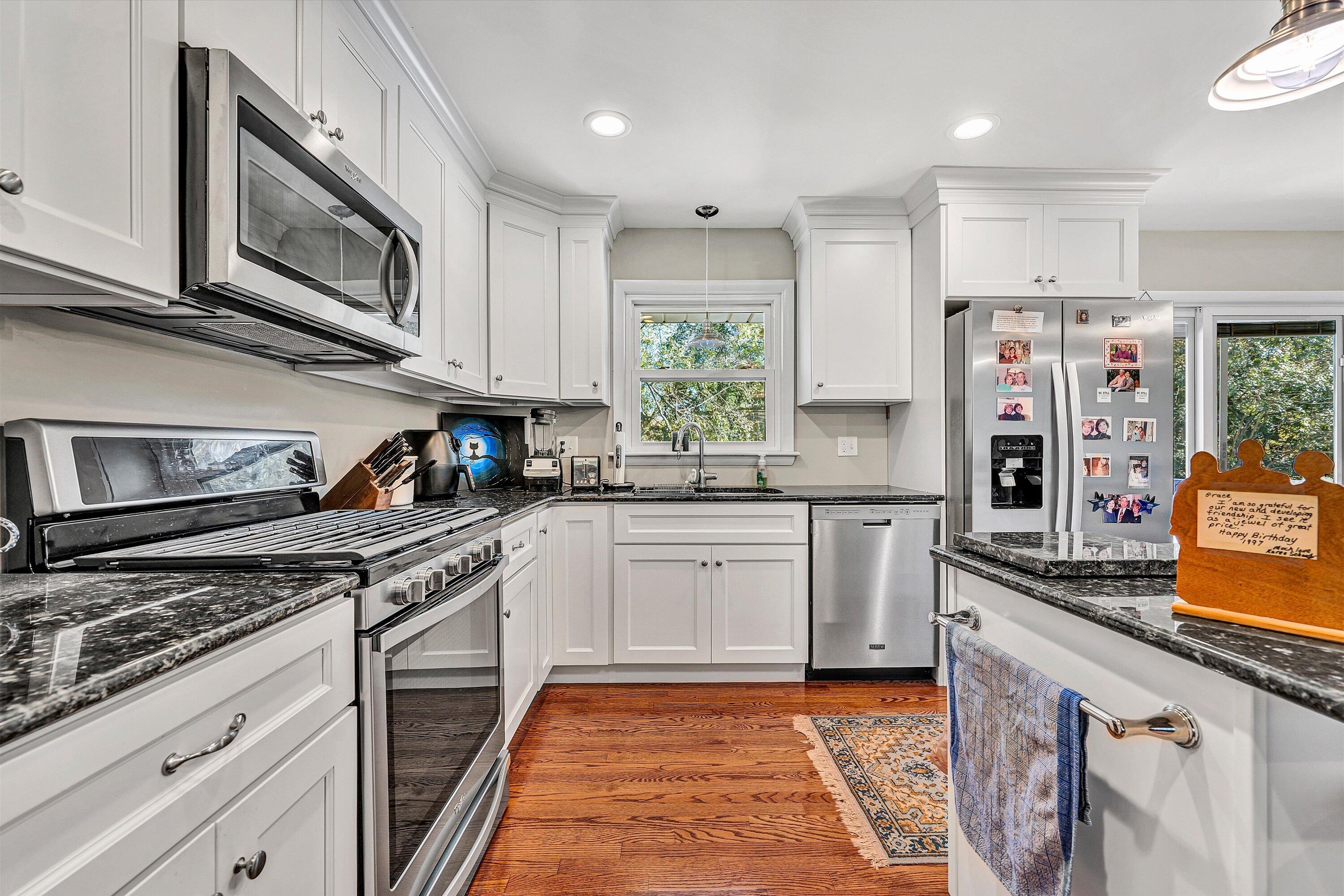 2312 Kipling Street Southwest Roanoke, VA 24018 - Photo 16 of 52 a kitchen with stainless steel appliances granite countertop a stove a sink and a microwave