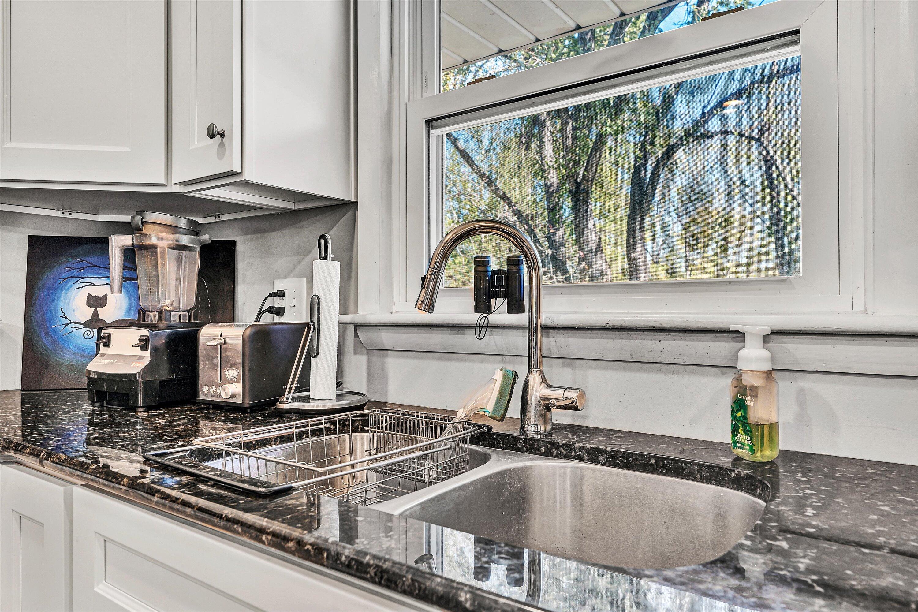 2312 Kipling Street Southwest Roanoke, VA 24018 - Photo 17 of 52 a kitchen sink with granite countertop a stove a sink and a cabinets