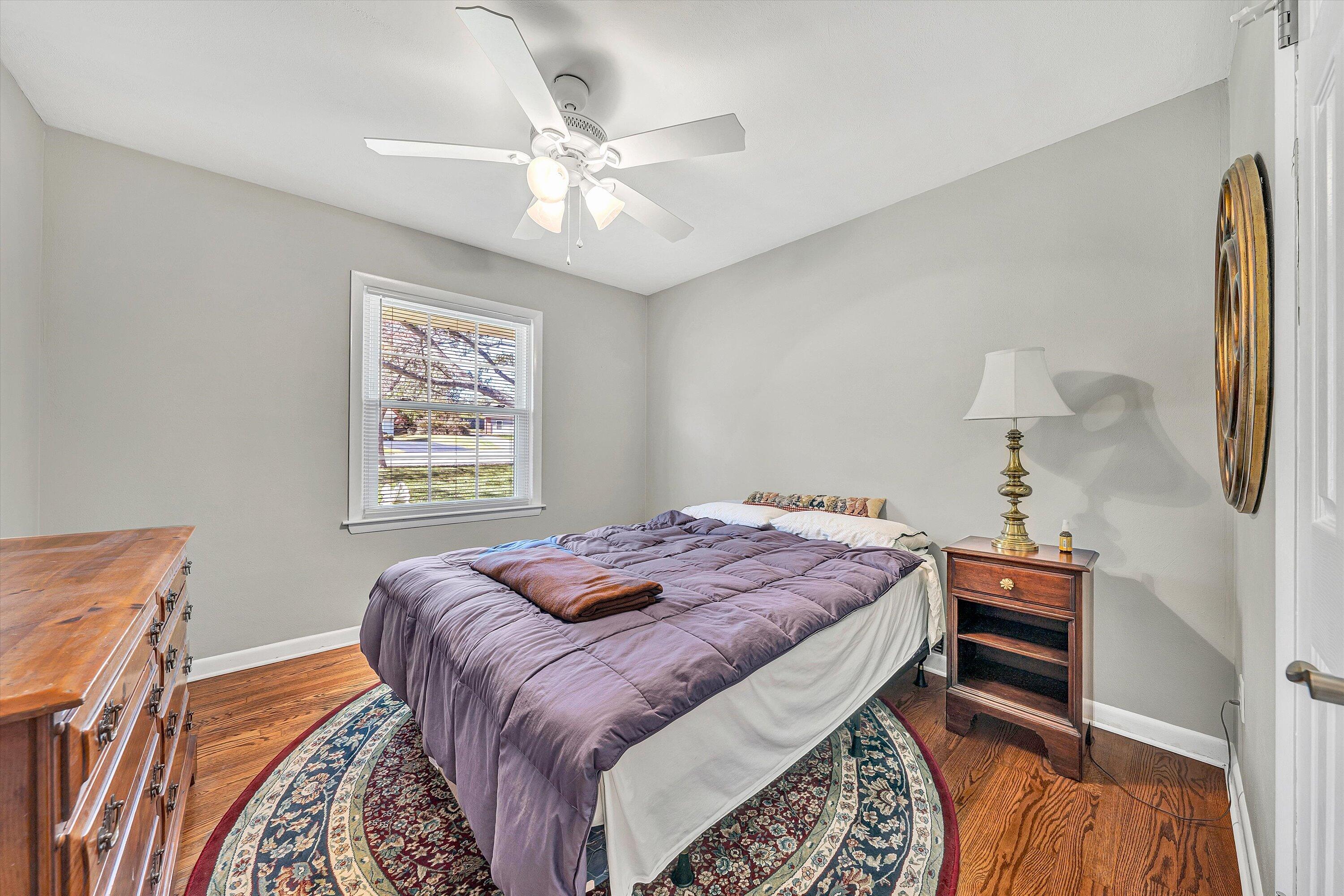 2312 Kipling Street Southwest Roanoke, VA 24018 - Photo 24 of 52 a bedroom with a bed and a chandelier