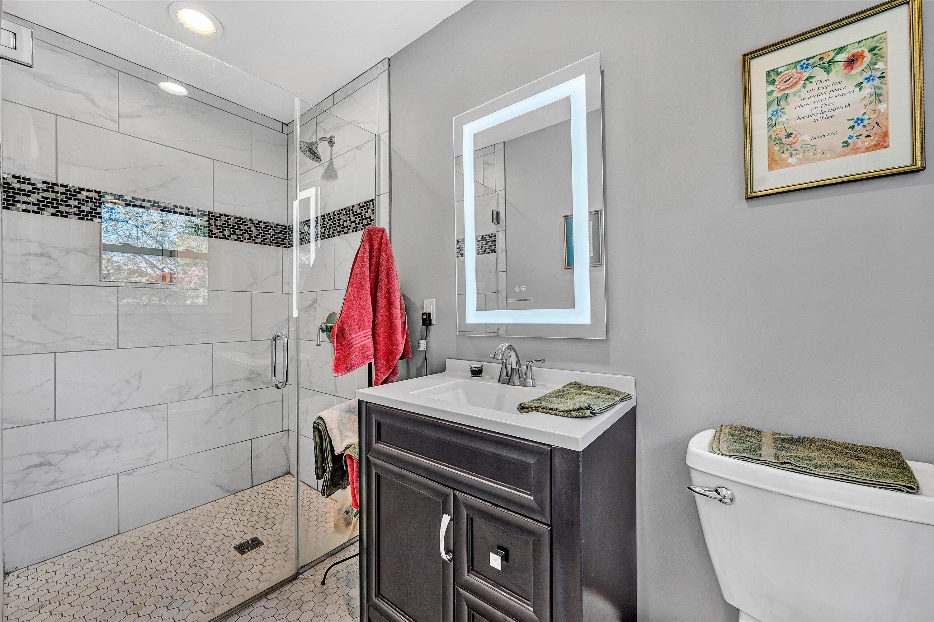 2312 Kipling Street Southwest Roanoke, VA 24018 - Photo 30 of 52 a bathroom with a sink a toilet a shower and a mirror