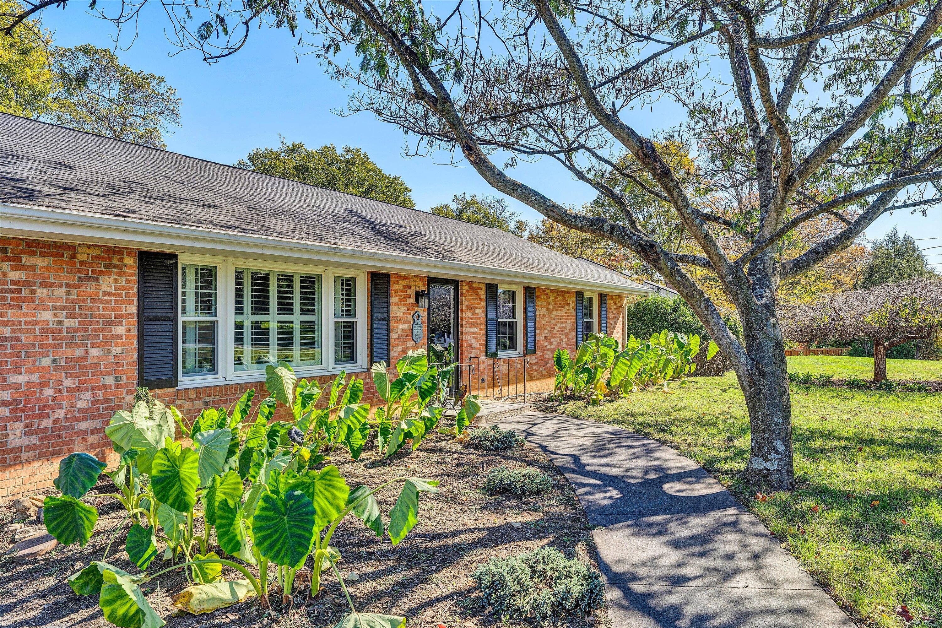 2312 Kipling Street Southwest Roanoke, VA 24018 - Photo 4 of 52 a front view of a house with garden
