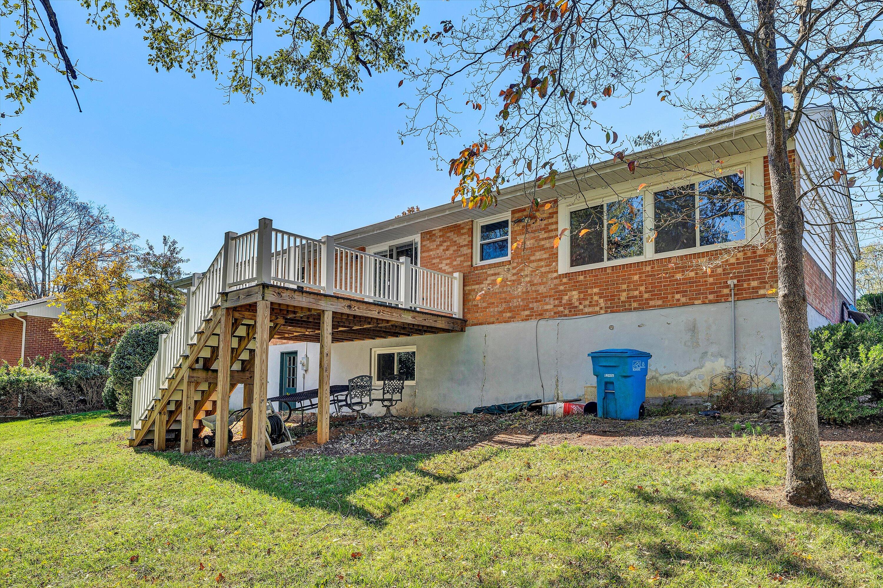 2312 Kipling Street Southwest Roanoke, VA 24018 - Photo 44 of 52 a view of a house with a yard patio and fire pit
