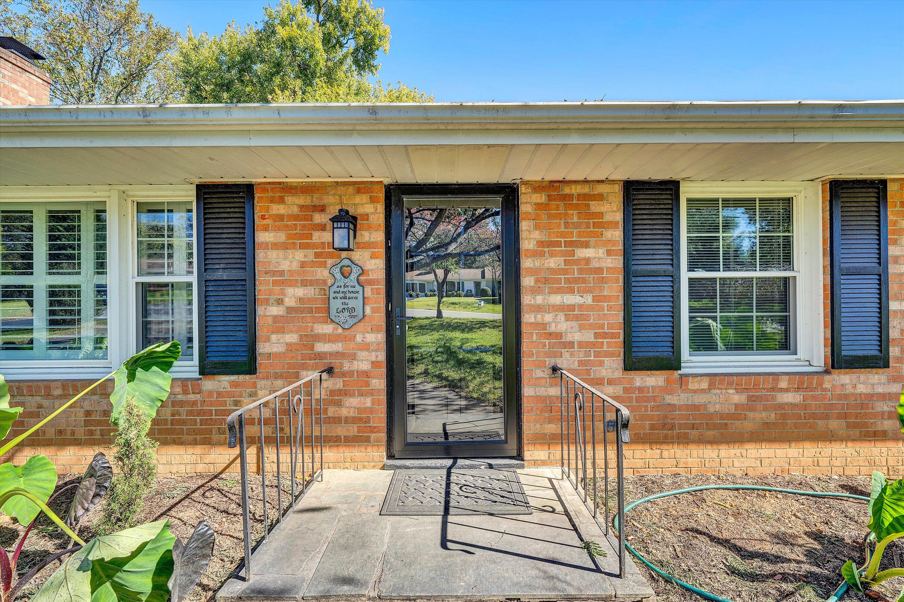 2312 Kipling Street Southwest Roanoke, VA 24018 - Photo 5 of 52 a front view of a house with a garden