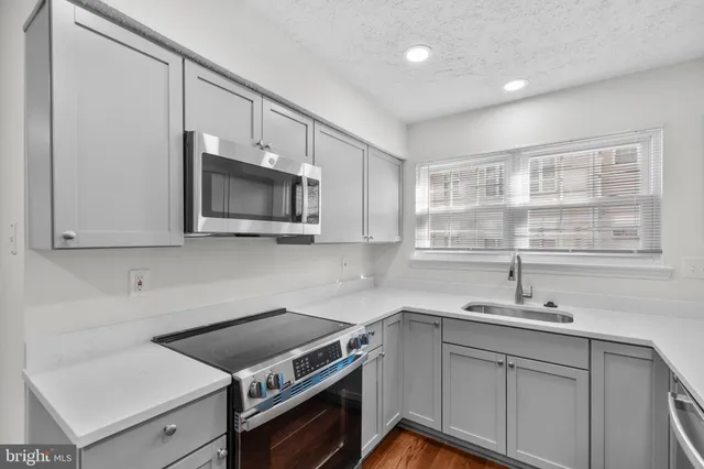 a kitchen with a stove and a sink