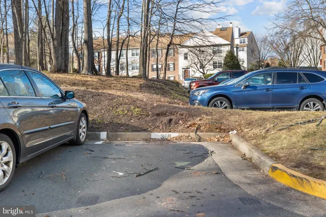 a view of a car parked in front of a house