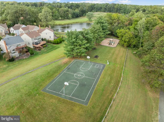 a view of a swimming pool with a yard