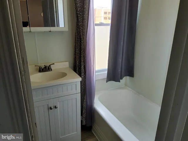 a bathroom with a sink and bathtub