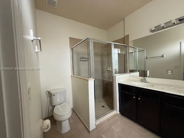 a bathroom with a toilet sink and shower