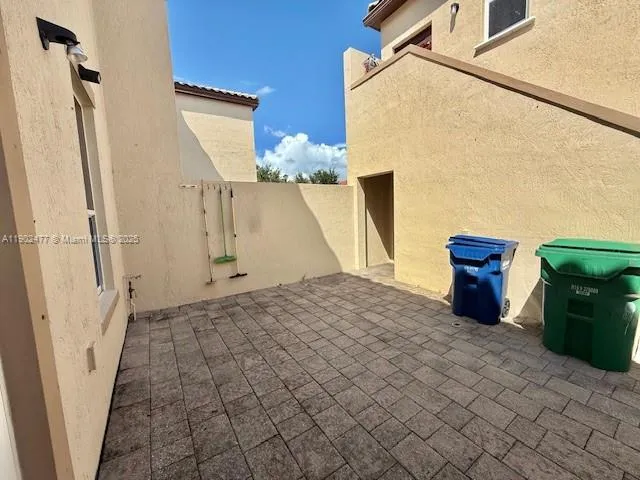 a view of a door and an empty room