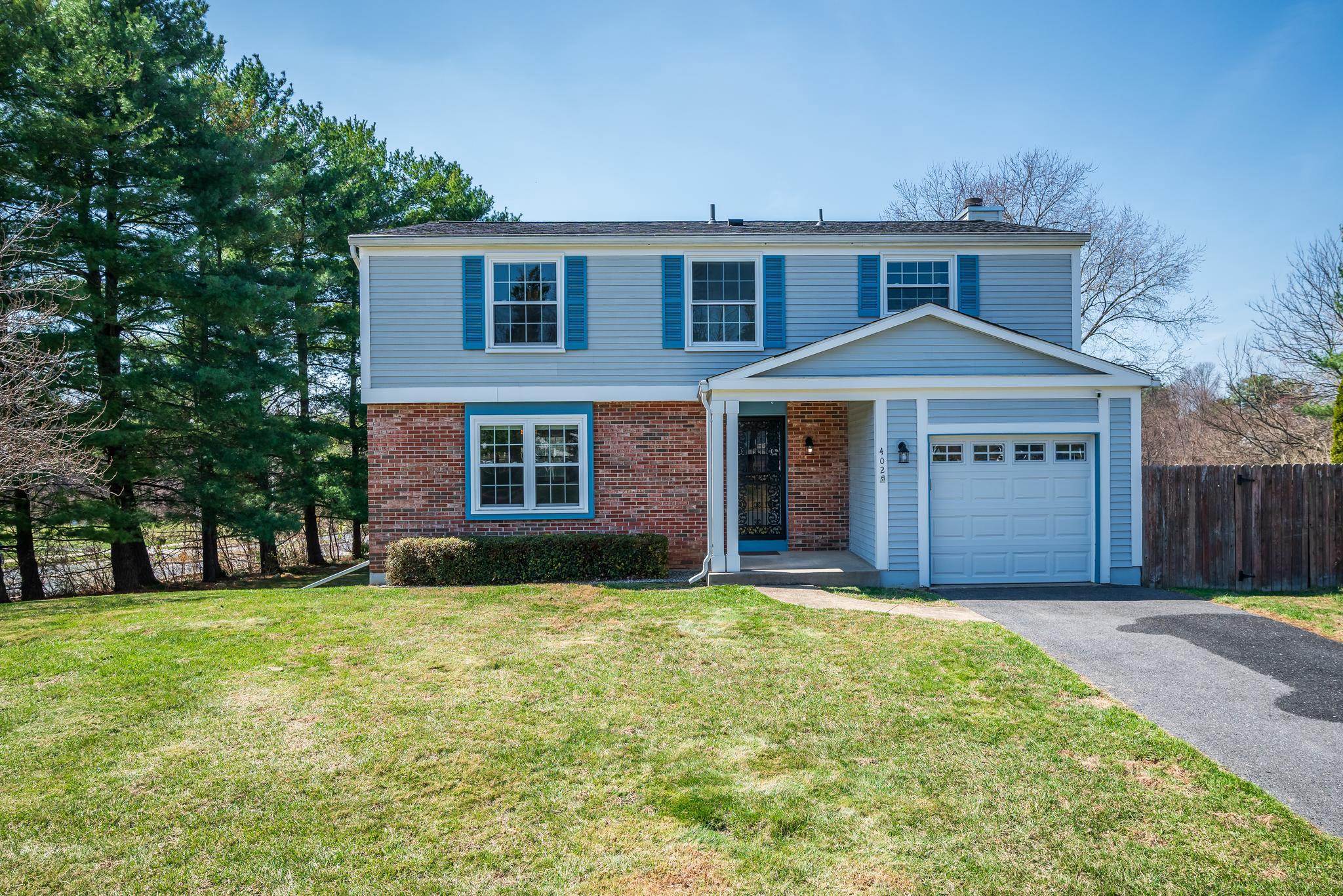 402 Belle Grove Road Gaithersburg, MD 20877 - Photo 1 of 1 a front view of a house with a yard