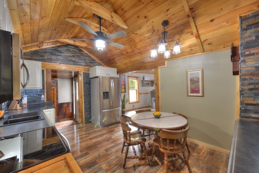 95 Sylvester Road Northampton, MA 01062 - Photo 12 of 42 a view of a dining room with furniture and wooden floor