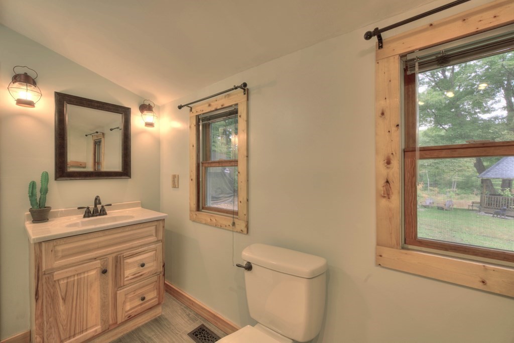 95 Sylvester Road Northampton, MA 01062 - Photo 16 of 42 a bathroom with a toilet sink and mirror