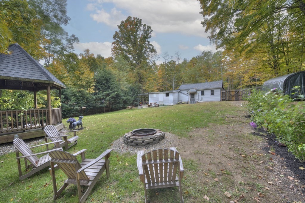 95 Sylvester Road Northampton, MA 01062 - Photo 3 of 42 a view of a table and chairs in backyard of the house