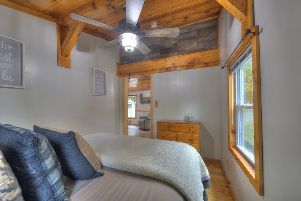 95 Sylvester Road Northampton, MA 01062 - Photo 34 of 42 a bedroom with a bed and a chandelier