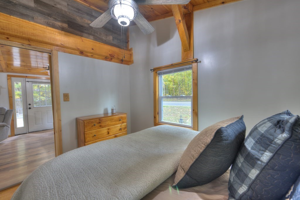95 Sylvester Road Northampton, MA 01062 - Photo 35 of 42 a bedroom with a bed and wooden floor