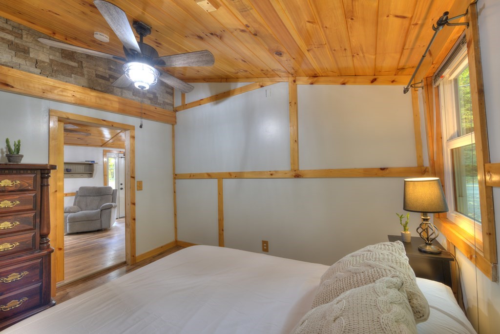 95 Sylvester Road Northampton, MA 01062 - Photo 39 of 42 a bedroom with a bed and glass door