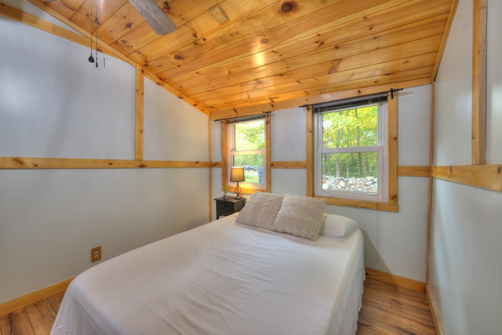 95 Sylvester Road Northampton, MA 01062 - Photo 40 of 42 a bedroom with a bed and a large window with the outer view