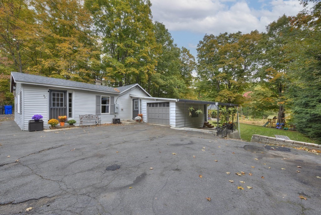 95 Sylvester Road Northampton, MA 01062 - Photo 41 of 42 a view of a house with backyard and trees