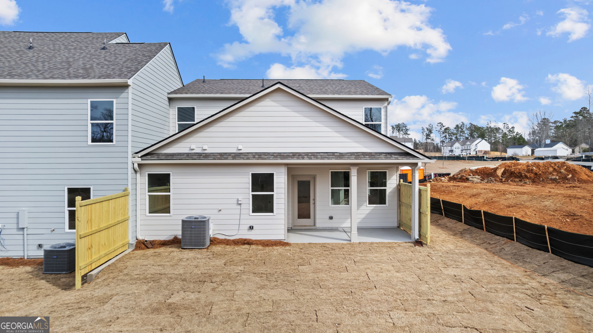 46 Umber Lane Newnan, GA 30263 - Photo 2 of 10 a view of a house with a wooden fence