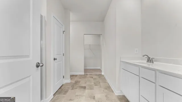 a bathroom with a sink and mirror