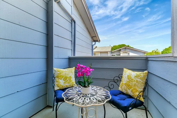 a view of balcony with a potted plant