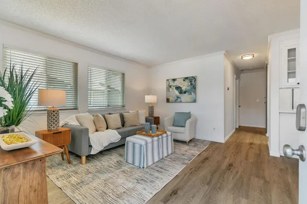 a living room with furniture and a large window
